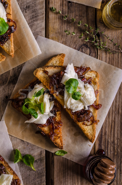 Rustic toast with caramelized onion and goat cheese Stock photo © Peteer