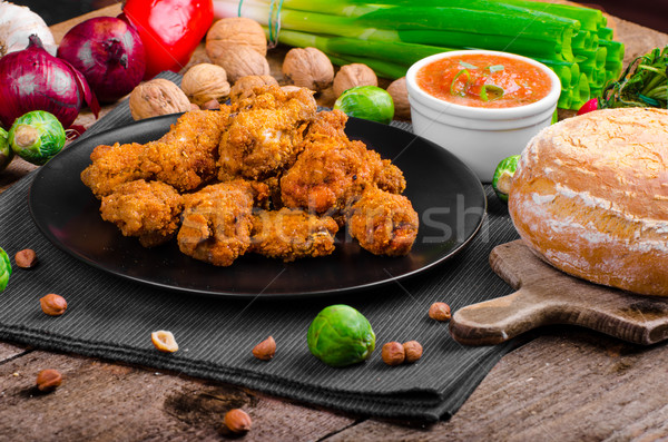 Spicy breaded chicken wings with homemade bread Stock photo © Peteer