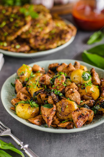 Potato pancakes, fried chicken with potatoes Stock photo © Peteer