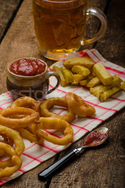Onion rings, hot dip, french fries and Czech beer Stock photo © Peteer