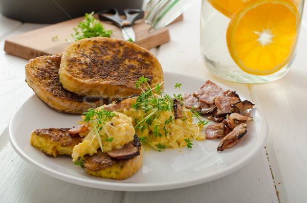 Scrambled eggs with French toast topped with watercress Scrambled eggs with watercress, french toast Stock photo © Peteer