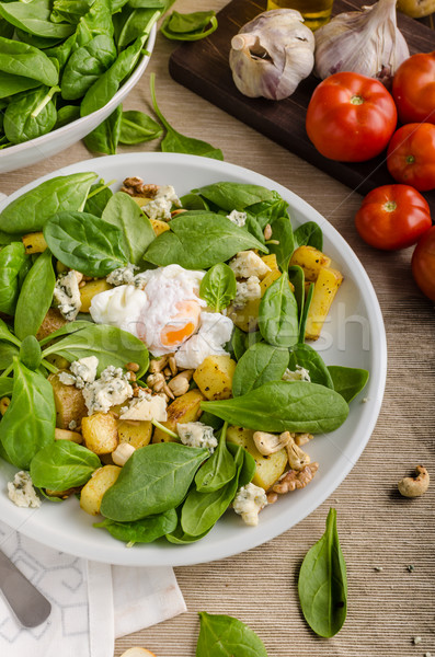 Stock photo: Spinach salad with egg benedict