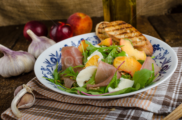 Rocket salad with prosciutto and fruit Stock photo © Peteer