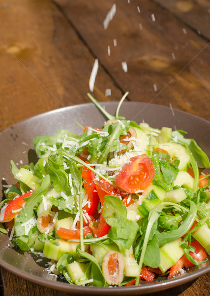 Arugula Salad with tomatoes, olives and parmesan Stock photo © Peteer