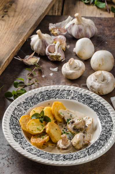 Stock photo: Mushroom sauce with roasted potatoes