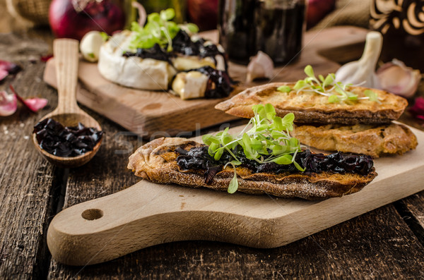 Toasted bread with brie cheese and caramelized onions Stock photo © Peteer