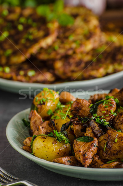 Potato pancakes, fried chicken with potatoes Stock photo © Peteer