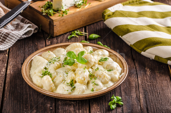Cheese gnocchi with blue cheese sauce and galic Stock photo © Peteer