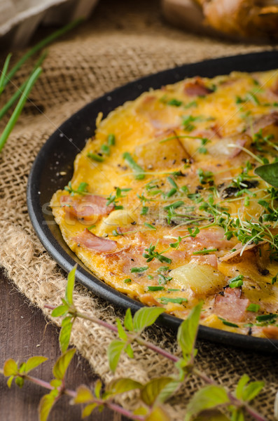 Egg omeletta with ham and herbs Stock photo © Peteer