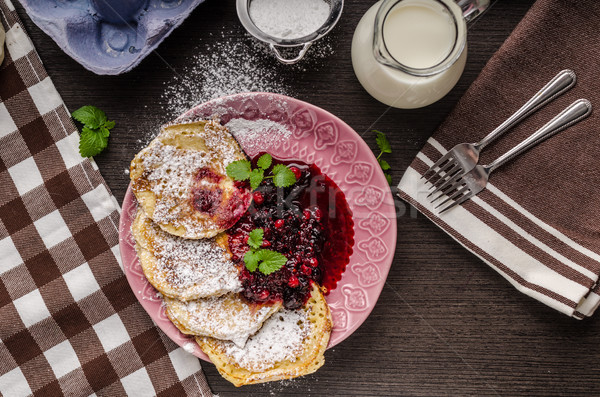 Stock photo: Crepes pancakes with berries reduction