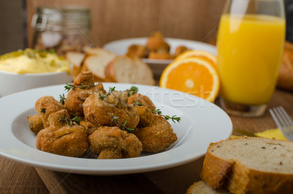 Breaded fried mushrooms with juice Stock photo © Peteer