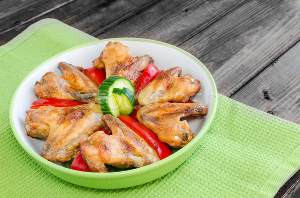Chicken wings baked with vegetable Stock photo © Peteer