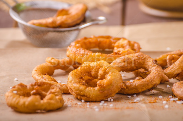 Onion rings with chili on top Stock photo © Peteer