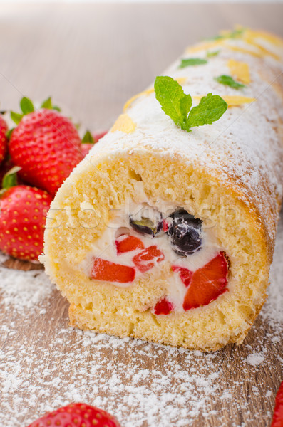 Sponge roll with strawberries and blueberries Stock photo © Peteer