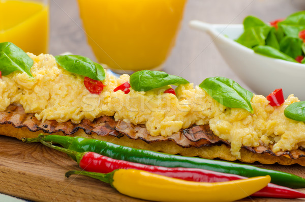 Scrambled eggs with toast and fresh salad Stock photo © Peteer
