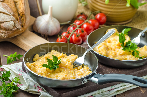 Scrambled eggs with herbs and homemade bread Stock photo © Peteer