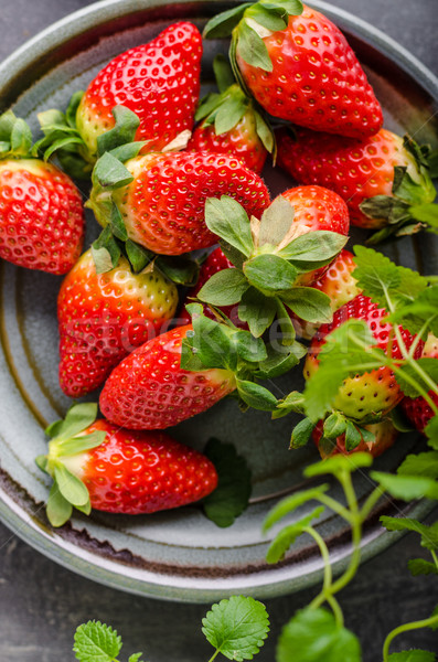 Strawberries fresh pick up Stock photo © Peteer