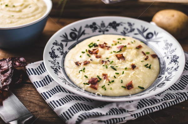Mashed potatoes, fresh herb and crispy bacon in Stock photo © Peteer
