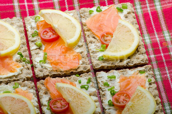 Bio healthy food - kneckebrot spread cheese with smoked salmon and cherry tomatoes Stock photo © Peteer