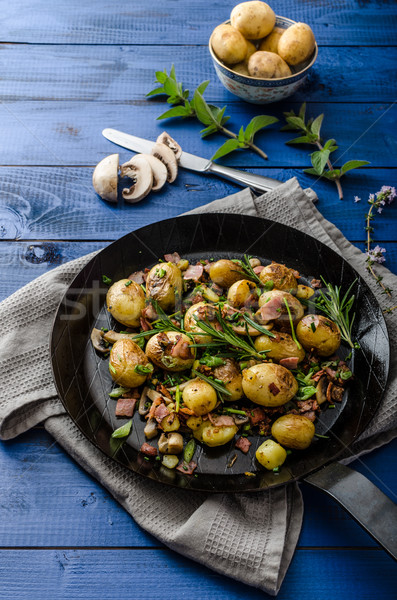 Cowboy potatoes with bacon and herbs Stock photo © Peteer