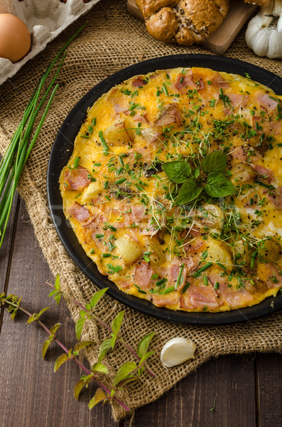 Egg omeletta with ham and herbs Stock photo © Peteer