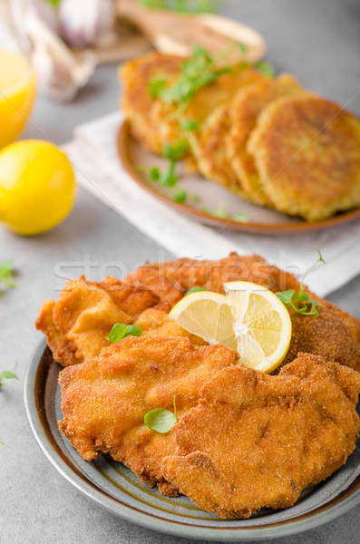 Delicious original schnitzel with potato pancakes Stock photo © Peteer