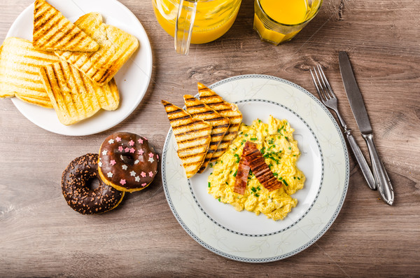 Scrembled eggs with panini toast and donut Stock photo © Peteer