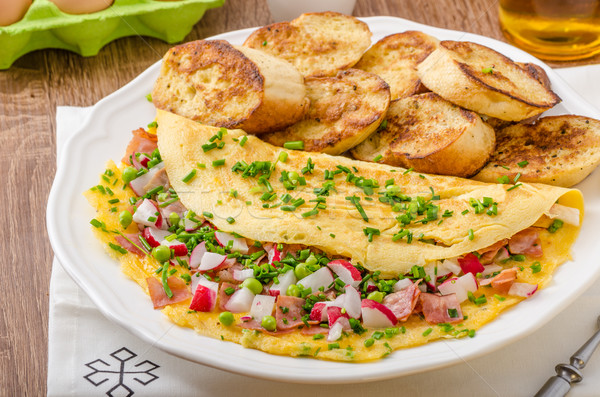 Omelette with spring vegetables and bacon Stock photo © Peteer