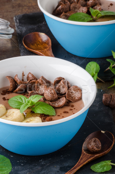 Chocolate pudding, banana and herbs in Stock photo © Peteer