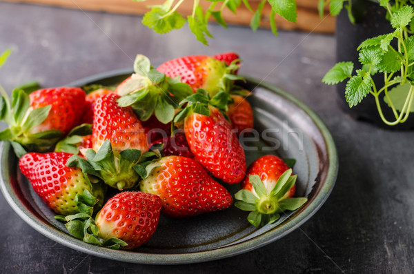 Strawberries fresh pick up Stock photo © Peteer