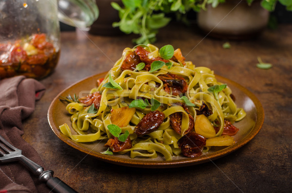 Pasta with sun dried tomatoes Stock photo © Peteer