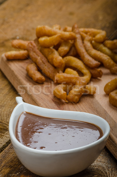 Churros with chocolate dip - Streed food, deep fried Stock photo © Peteer