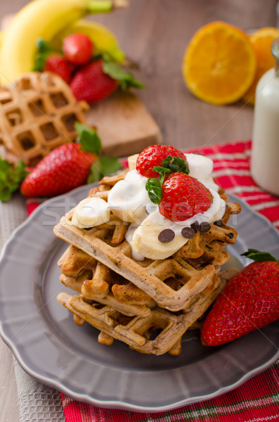 Belgian waffles with chocolate chips and fruits Stock photo © Peteer