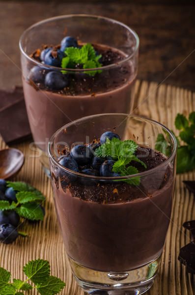 Chocolate pudding with berries and herbs Stock photo © Peteer