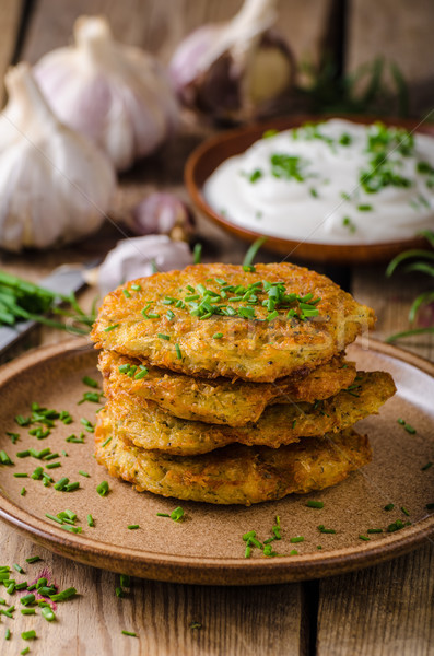 Potato pancakes with sour cream Stock photo © Peteer