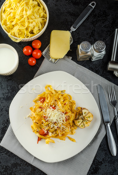 Stockfoto: Eigengemaakt · tagliatelle · knoflook · kerstomaatjes · bio