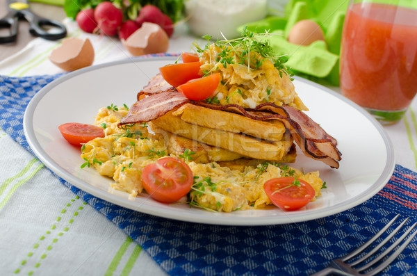 Scrambled eggs with bacon and French toast Stock photo © Peteer