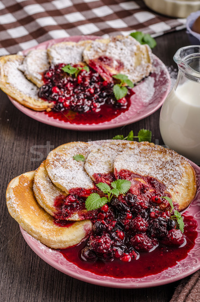 Crepes pancakes with berries reduction Stock photo © Peteer