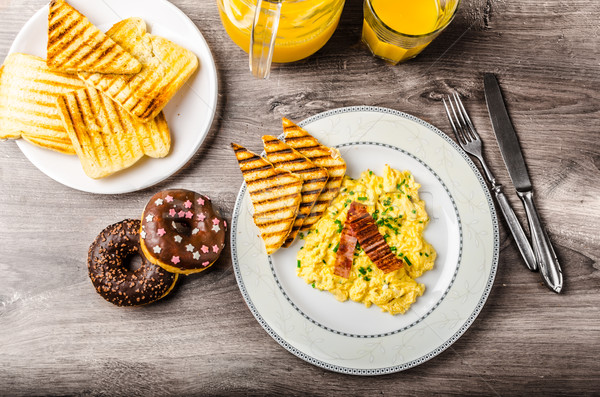 Scrembled eggs with panini toast and donut Stock photo © Peteer