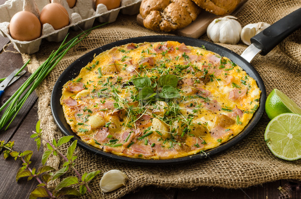 Egg omeletta with ham and herbs Stock photo © Peteer