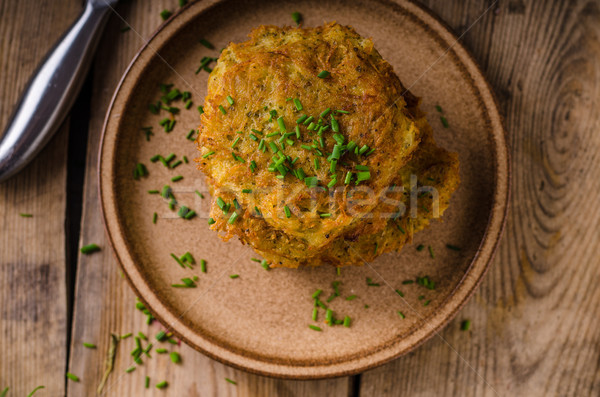 Potato pancakes with sour cream Stock photo © Peteer