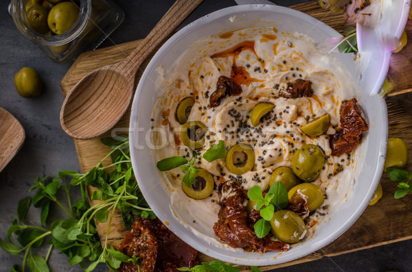 Fresh cheese with olives, dried tomatoes Stock photo © Peteer