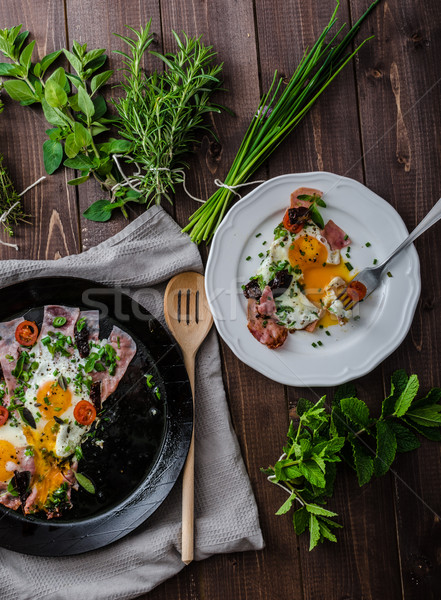Fried eggs with ham and herbs Stock photo © Peteer