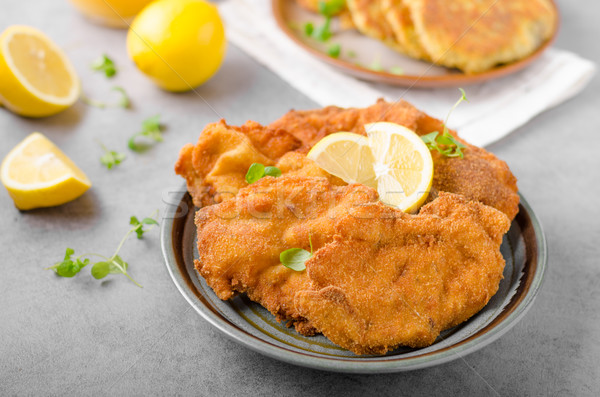 Delicious original schnitzel with potato pancakes Stock photo © Peteer