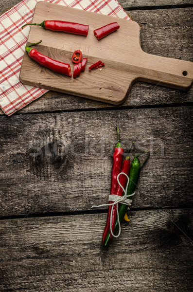 Chilli peppers, wood table, background Stock photo © Peteer