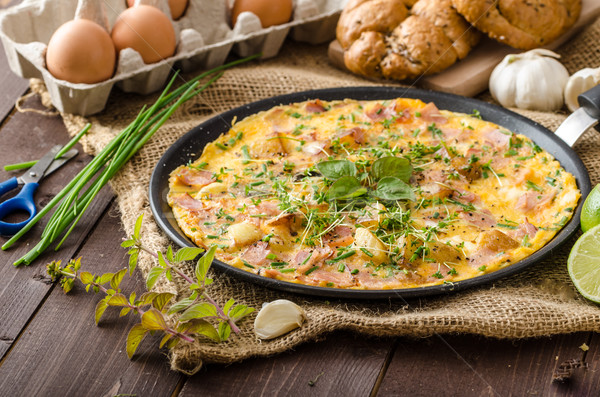 Egg omeletta with ham and herbs Stock photo © Peteer