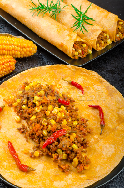 Stock photo: Tomato tortilla with spicy meat mixture