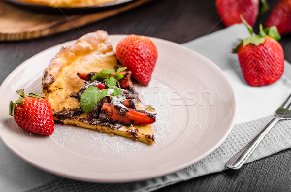 Pancake in oven, dutch baby pancake with strawberries Stock photo © Peteer