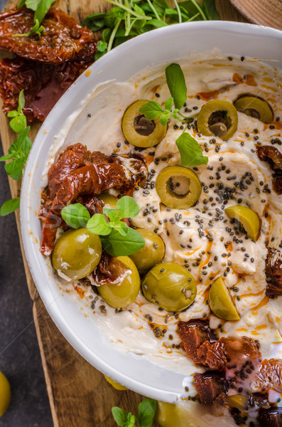 Fresh cheese with olives, dried tomatoes Stock photo © Peteer