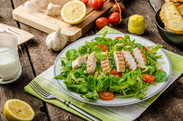 Arugula and lamb's lettuce with grilled chiken Stock photo © Peteer